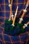 Symbols of Scotland - wollen tartan textile and handmade musical instrument bagpipes