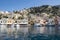 Symi Main Port with Boats and Yachts and Colorful Houses