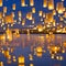 A symmetrical arrangement of floating lanterns, casting a warm and inviting glow in the night sky3, Generative AI