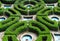 Symmetrical baroque topiary garden with boxwood and water ponds