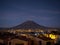 Symmetrical cone-shaped snow-capped stratovolcano El Misti seen from andes City Arequipa Peru at night