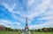 Symmetrical front panoramic view of Eiffel tower on a bright Summer day taken from fountains of Trocadero