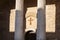 symmetrical photo of a cross and two columns in the city of assisi