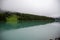 Symmetrical picture of the trees reflected on the surface of Emerald lake.