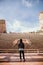 Symmetrical Portrait of Male Person Standing Front and Center on a Stage Dreaming and Imagining the Future while Facing Stadium St