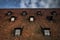 Symmetrical roof windows. Red tile. Seven windows on blue sky background.