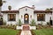 a symmetrical spanish revival home front view