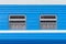 Symmetrical windows of the blue locomotive wagon.