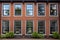 symmetry of windows in a colonial brick house