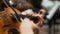 Symphony concert, a man playing the cello, hand close up