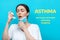 Symptoms of asthma. A woman takes a medical mask to make the inhalation of medication. Blue background with text