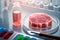 Synthetic meat in a petri dish on the background of the laboratory.Artificial meat or protein concept.