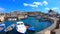 Syracuse, Sicily, Italy - April 10th 2019: Beautiful harbor with boats in near the bridge that connects the city with Ortigia