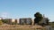 syracuse sicily italy buildings with grass and trees in front sky above 572 v