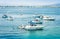 Syracuse, Sicily, Italy â€“ august 12, 2018: people relax on the sailboats, motor boat near seacoast of Ortygia Ortigia Island,