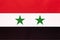 Syria national fabric flag, textile background. Symbol of international asian arab world country