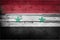 Syria national flag on wooden rustic background.