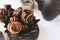 Syrian sweets are served on the table. A mixture of Arabic sweets and dates of hastac. Dried fruit rolls stuffed with walnuts