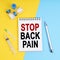 A syringe, ampoules and a notebook with the inscription - STOP BACK PAIN