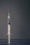 Syringe on blue wooden table with dark window shadows. Covid-19 vaccine concept year 2021. Coronavirus vaccine