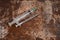 Syringe and drugs on dirty rusty background. Injection syringe. addiction