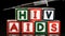 Syringe falling on blocks spelling Aids and Hiv