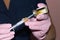Syringe for injection in hands of beautician