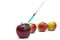 Syringe injection into a red apple. Genetic modified foods
