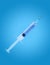 Syringe with medication for injection isolated on blue background with clipping path.