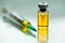 Syringe with needle & vial ampoule with yellow liquid