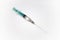 Syringe with needle on white background