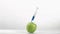 Syringe in super flow motion falling in a apple