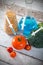 Syringe in tomato. Genetically modified food concept on wooden background