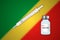 Syringe and vaccine vial on blur background with Congo flag