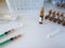 Syringes, ampoules, saline on a white background. Medical background for business, pharmacies, clinics, hospitals.