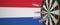 Syringes with a vaccine hit target near the Dutch flag. Successful research and vaccination in the Netherlands