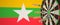 Syringes with a vaccine hit target near the Myanma flag. Successful research and vaccination in Myanmar. Conceptual 3D