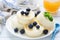 Syrniki, cottage cheese pancakes or cheesecakes with fresh berries and honey