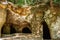 System of caves in sandstone rocks called Puste kostely, Czech republic.Entrance to large underground quarry.Popular tourist