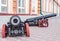 Syzran`, Russia - August, 16,2016: Two black cannons with red wheels as installation near the City Lore Museum.