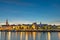 Szczecin. Night view from across the river to the illuminated historic center. Odra river. Chrobry embankments in Szczecin