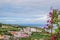 SÃ£o Miguel, Azores PORTUGAL - 8 August 2020 - Village of Bretanha with fields of agriculture and Church, and defocused flowers