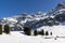 SÃ¤ntis mountain during the day with bright sunshine and beautiful blue cloudless sky, the bergaus with the transmission tower for