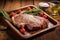 t-bone steak with grill marks on a rustic wooden tray