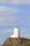 TÅµr Mawr lighthouse, on Ynys Llanddwyn on Anglesey, Wales, marks the western entrance to the Menai Strait.