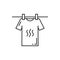 T-shirt hanging on clothesline cloth pins isolated