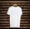 T-shirt mockup and template on wood background for fashion and graphic designer