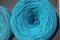 T-shirt yarn balls light blue color on shop shielf. Handmade craft recycle eco concept