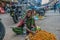 T Stock photo of  60 to 70 aged Indian grandma or old women wearing saree , selling jujube fruitit on the street of city market .