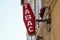 Tabac light French Red shop tobacco sign with french white text logo on shop building